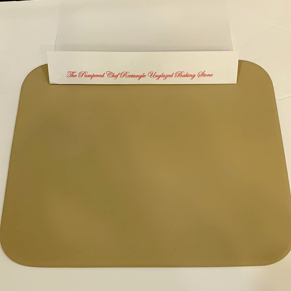 The Pampered Chef rectangular, unglazed, baking stone.